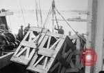 Image of a crane unloading military equipment Bordeaux France, 1918, second 18 stock footage video 65675048400