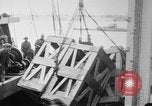 Image of a crane unloading military equipment Bordeaux France, 1918, second 19 stock footage video 65675048400