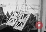 Image of a crane unloading military equipment Bordeaux France, 1918, second 20 stock footage video 65675048400