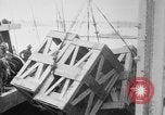Image of a crane unloading military equipment Bordeaux France, 1918, second 22 stock footage video 65675048400