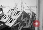 Image of a crane unloading military equipment Bordeaux France, 1918, second 23 stock footage video 65675048400