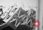 Image of a crane unloading military equipment Bordeaux France, 1918, second 25 stock footage video 65675048400