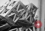 Image of a crane unloading military equipment Bordeaux France, 1918, second 28 stock footage video 65675048400