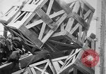 Image of a crane unloading military equipment Bordeaux France, 1918, second 30 stock footage video 65675048400