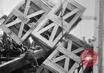 Image of a crane unloading military equipment Bordeaux France, 1918, second 38 stock footage video 65675048400