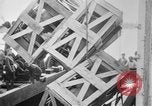 Image of a crane unloading military equipment Bordeaux France, 1918, second 40 stock footage video 65675048400