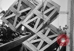 Image of a crane unloading military equipment Bordeaux France, 1918, second 41 stock footage video 65675048400