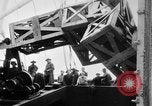 Image of a crane unloading military equipment Bordeaux France, 1918, second 60 stock footage video 65675048400