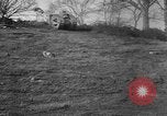 Image of Mark VIII tank driving through a stone wall Bridgeport Connecticut USA, 1918, second 4 stock footage video 65675048450