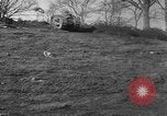 Image of Mark VIII tank driving through a stone wall Bridgeport Connecticut USA, 1918, second 5 stock footage video 65675048450