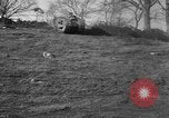Image of Mark VIII tank driving through a stone wall Bridgeport Connecticut USA, 1918, second 6 stock footage video 65675048450