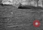 Image of Mark VIII tank driving through a stone wall Bridgeport Connecticut USA, 1918, second 7 stock footage video 65675048450