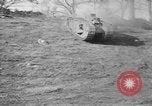 Image of Mark VIII tank driving through a stone wall Bridgeport Connecticut USA, 1918, second 10 stock footage video 65675048450