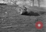 Image of Mark VIII tank driving through a stone wall Bridgeport Connecticut USA, 1918, second 12 stock footage video 65675048450