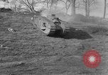 Image of Mark VIII tank driving through a stone wall Bridgeport Connecticut USA, 1918, second 13 stock footage video 65675048450