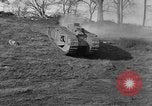 Image of Mark VIII tank driving through a stone wall Bridgeport Connecticut USA, 1918, second 15 stock footage video 65675048450