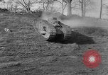 Image of Mark VIII tank driving through a stone wall Bridgeport Connecticut USA, 1918, second 16 stock footage video 65675048450