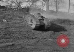 Image of Mark VIII tank driving through a stone wall Bridgeport Connecticut USA, 1918, second 17 stock footage video 65675048450