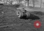 Image of Mark VIII tank driving through a stone wall Bridgeport Connecticut USA, 1918, second 18 stock footage video 65675048450