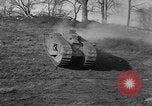 Image of Mark VIII tank driving through a stone wall Bridgeport Connecticut USA, 1918, second 20 stock footage video 65675048450