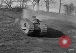 Image of Mark VIII tank driving through a stone wall Bridgeport Connecticut USA, 1918, second 22 stock footage video 65675048450