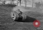Image of Mark VIII tank driving through a stone wall Bridgeport Connecticut USA, 1918, second 23 stock footage video 65675048450