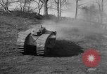 Image of Mark VIII tank driving through a stone wall Bridgeport Connecticut USA, 1918, second 25 stock footage video 65675048450