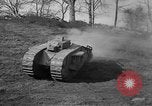 Image of Mark VIII tank driving through a stone wall Bridgeport Connecticut USA, 1918, second 26 stock footage video 65675048450
