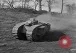 Image of Mark VIII tank driving through a stone wall Bridgeport Connecticut USA, 1918, second 27 stock footage video 65675048450