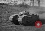 Image of Mark VIII tank driving through a stone wall Bridgeport Connecticut USA, 1918, second 30 stock footage video 65675048450