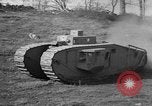 Image of Mark VIII tank driving through a stone wall Bridgeport Connecticut USA, 1918, second 32 stock footage video 65675048450