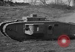 Image of Mark VIII tank driving through a stone wall Bridgeport Connecticut USA, 1918, second 35 stock footage video 65675048450
