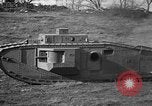 Image of Mark VIII tank driving through a stone wall Bridgeport Connecticut USA, 1918, second 36 stock footage video 65675048450