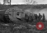 Image of Mark VIII tank driving through a stone wall Bridgeport Connecticut USA, 1918, second 45 stock footage video 65675048450