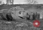 Image of Mark VIII tank driving through a stone wall Bridgeport Connecticut USA, 1918, second 52 stock footage video 65675048450