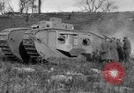Image of Mark VIII tank driving through a stone wall Bridgeport Connecticut USA, 1918, second 62 stock footage video 65675048450