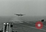 Image of British Royal Navy Hawker Seahawk aircraft practice arrested landings on the carrier USS Antietam Atlantic Ocean, 1953, second 4 stock footage video 65675048900