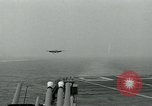 Image of British Royal Navy Hawker Seahawk aircraft practice arrested landings on the carrier USS Antietam Atlantic Ocean, 1953, second 12 stock footage video 65675048900