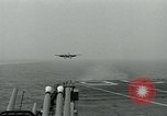 Image of British Royal Navy Hawker Seahawk aircraft practice arrested landings on the carrier USS Antietam Atlantic Ocean, 1953, second 13 stock footage video 65675048900