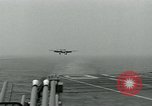 Image of British Royal Navy Hawker Seahawk aircraft practice arrested landings on the carrier USS Antietam Atlantic Ocean, 1953, second 20 stock footage video 65675048900