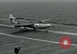 Image of British Royal Navy Hawker Seahawk aircraft practice arrested landings on the carrier USS Antietam Atlantic Ocean, 1953, second 23 stock footage video 65675048900