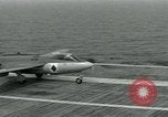 Image of British Royal Navy Hawker Seahawk aircraft practice arrested landings on the carrier USS Antietam Atlantic Ocean, 1953, second 25 stock footage video 65675048900