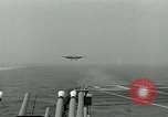 Image of British Royal Navy Hawker Seahawk aircraft practice arrested landings on the carrier USS Antietam Atlantic Ocean, 1953, second 27 stock footage video 65675048900