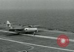 Image of British Royal Navy Hawker Seahawk aircraft practice arrested landings on the carrier USS Antietam Atlantic Ocean, 1953, second 32 stock footage video 65675048900