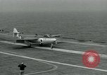 Image of British Royal Navy Hawker Seahawk aircraft practice arrested landings on the carrier USS Antietam Atlantic Ocean, 1953, second 35 stock footage video 65675048900