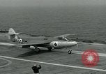 Image of British Royal Navy Hawker Seahawk aircraft practice arrested landings on the carrier USS Antietam Atlantic Ocean, 1953, second 44 stock footage video 65675048900
