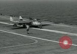 Image of British Royal Navy Vampire jet aircraft makes arrested landing aboard the U.S. carrier USS Antietam Atlantic Ocean, 1953, second 24 stock footage video 65675048902
