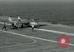 Image of British Royal Navy Vampire jet aircraft makes arrested landing aboard the U.S. carrier USS Antietam Atlantic Ocean, 1953, second 28 stock footage video 65675048902