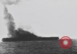 Image of USS Essex attacked by Kamikaze Pacific Theater, 1944, second 52 stock footage video 65675049006
