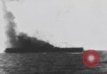 Image of USS Essex attacked by Kamikaze Pacific Theater, 1944, second 59 stock footage video 65675049006